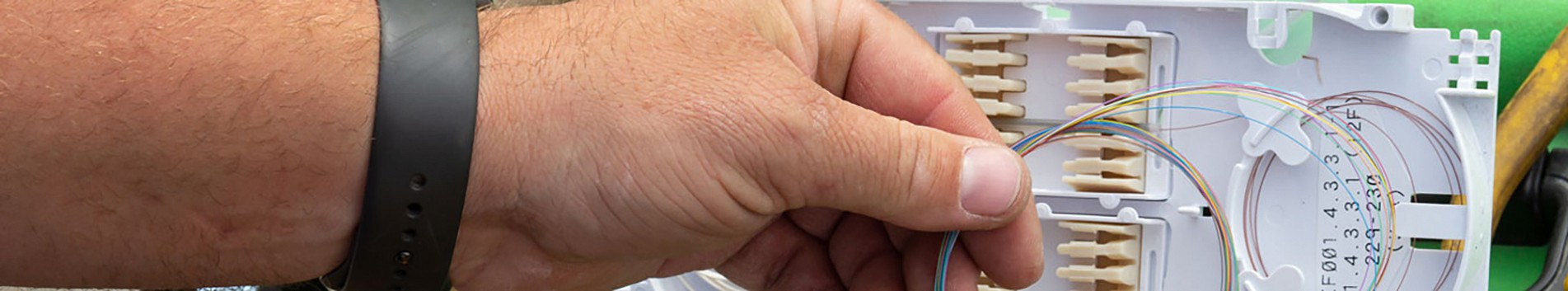 Photo of hand at a patch panel