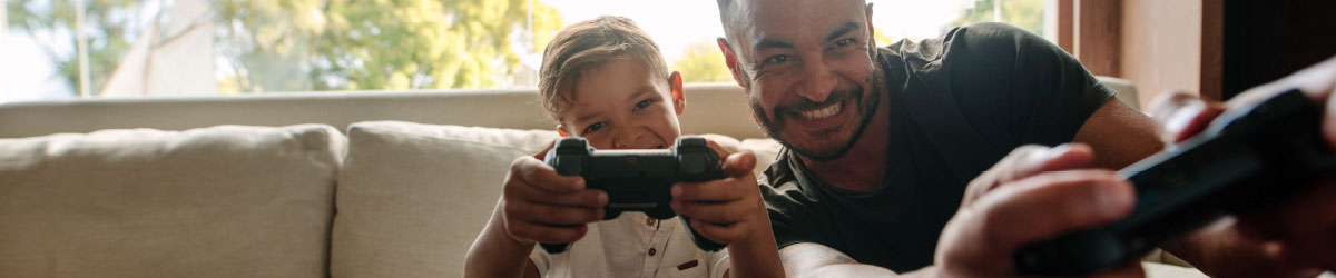 Photo of parent playing video games with child