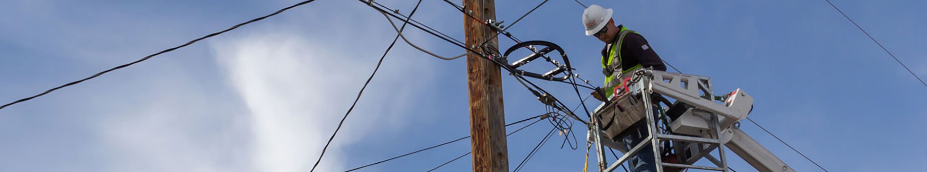 Photo of worker on a powerline